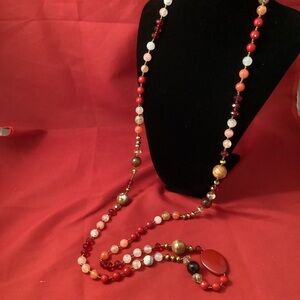 Red and gold tone mixed material long beaded necklace